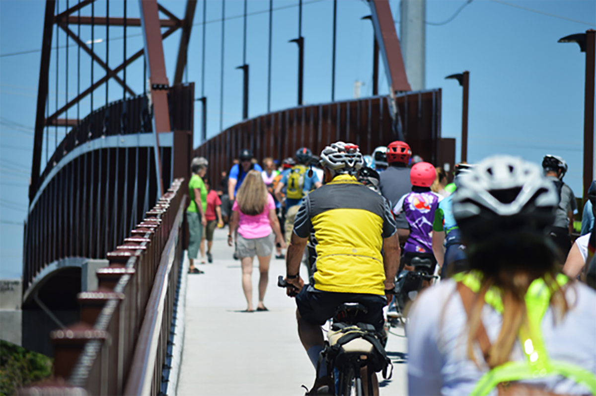 Bicyclists ride on the Jordan River Bridge. Photo courtesy of Justin Adams via My City Journals.